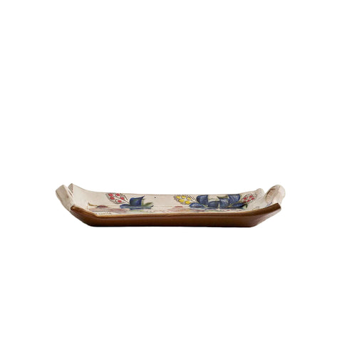 Ceramic tray with floral designs on a beige background