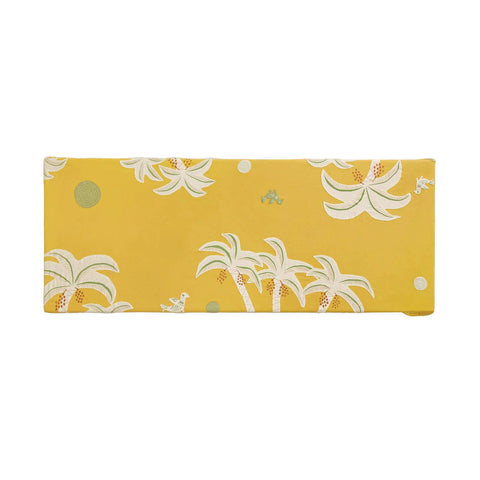 Yellow rectangular fabric with palm tree and flower pattern on a beige background