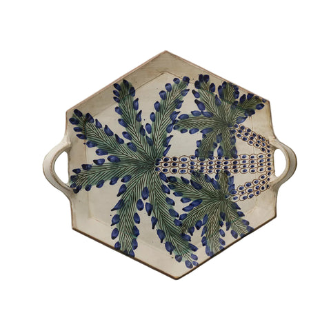 Decorative tray with floral design on a beige background