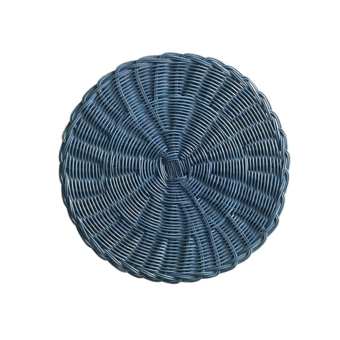 Blue woven round placemat on a beige background